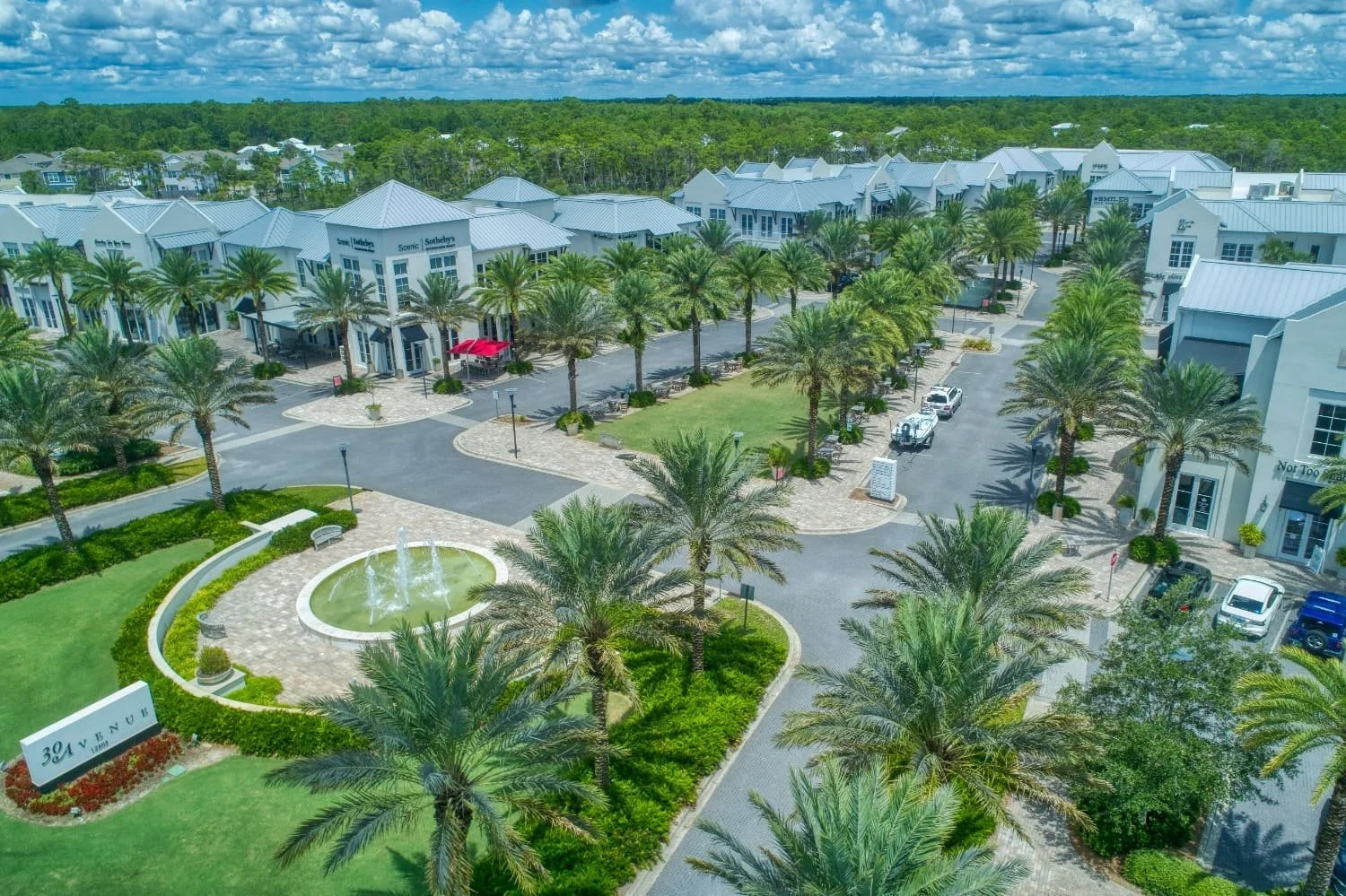 Aerial view of a commercial plaza with paver walkways and drive lanes in Jupiter, FL