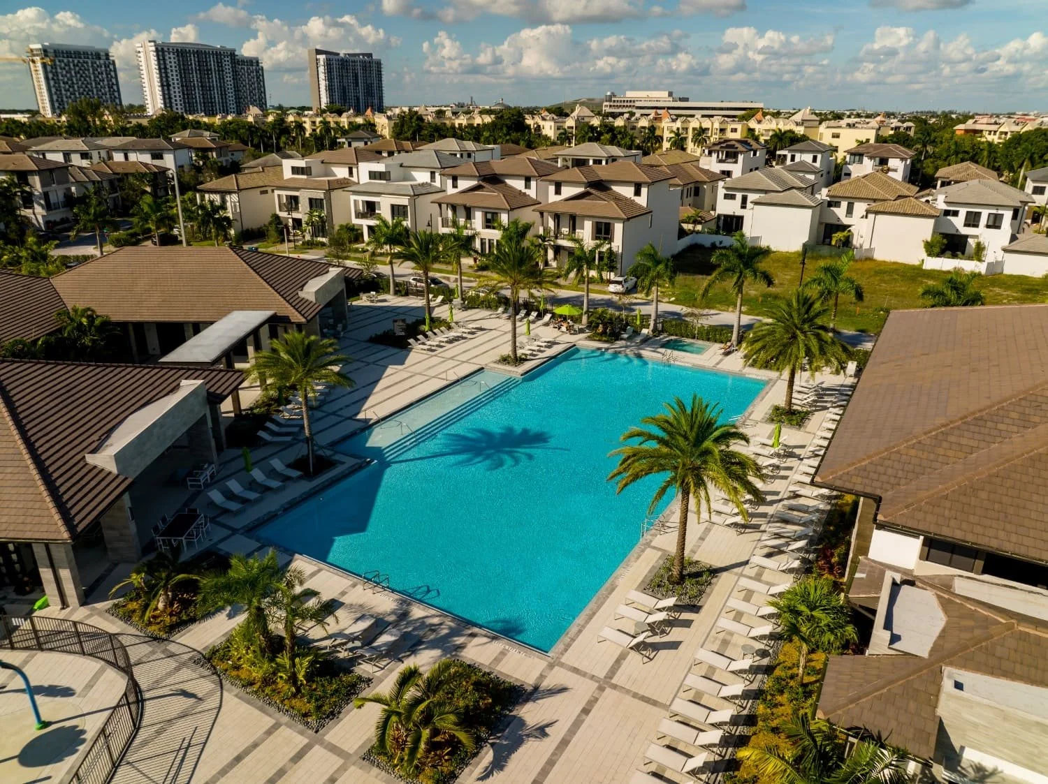 Aerial view of an HOA community pool deck with large-format pavers in Parkland, FL